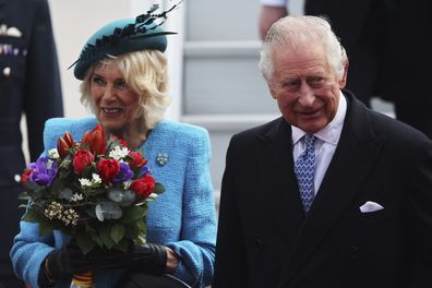 King Charles III and Camilla, the Queen Consort, arrive at the airport in Berlin, Wednesday, March 29, 2023. 