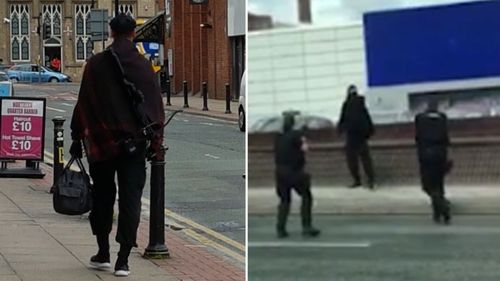 The man was pictured carrying the crossbow before he was surrounded by police. (Twitter)