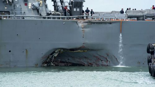 Guided-missile destroyer USS John S. McCain is moored pier side at Changi naval base in Singapore following a collision with the merchant vessel Alnic MC on August 21, 2017. (AP)