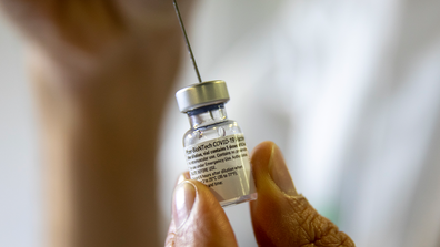 A health care professional prepares a Pfizer-BioNTech COVID-19 vaccine at a vaccination center in Jerusalem. (AP Photo/Ariel Schalit)