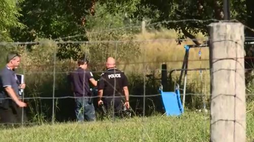 A child's swingset and slide is seen on the property. (9NEWS)
