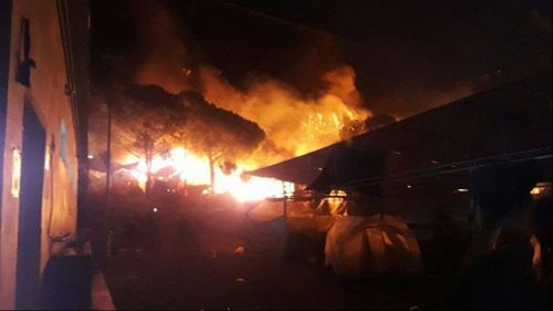 Thousands forced to flee after massive fire damages Greek refugee camp