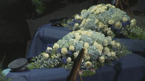 The coffins of Constables Rachel McCrow and Matthew Arnold at the memorial.