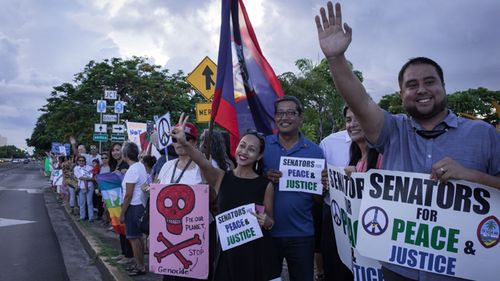 Members of community groups calling for the "de-colonization and de-militarization of Guam" attend a "People for Peace" rally in Hagatna on August 14, 2017. (AFP)