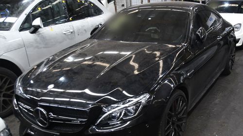 At least nine stolen luxury cars have been seized, some modified at a Summer Hill workshop.