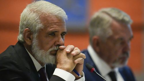Dr. Robert Malone, left, listens during a meeting of the Advisory Committee in Immunization Practices at the CDC, Wednesday, June 25, 2025, in Atlanta. 