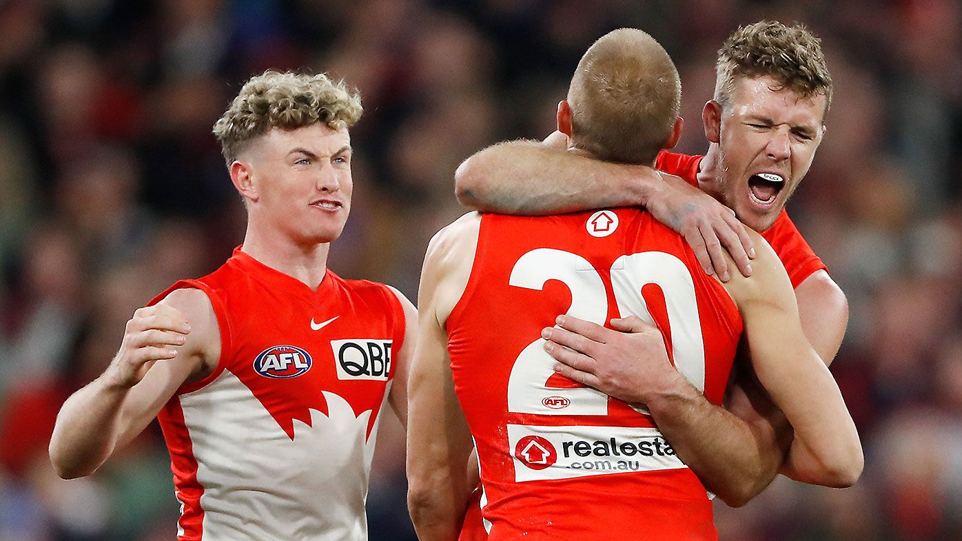 Sydney&#x27;s Chad Warner, Sam Reid and Luke Parker celebrate a goal