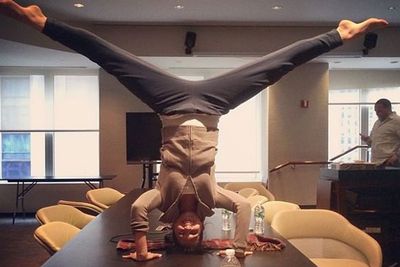 Although Hilaria's yoga moves are impressive, our fave part of this pic is the unfazed guy in the background.<br/><br/>What could possibly be more interesting than a split?