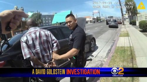 Bodycam footage from the LAPD appears to show the cocaine bag being planted on the driver. (CBS)