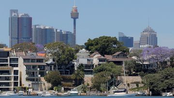 Sydney office buildings and commercial real estate appear behind Sydney waterfront properties