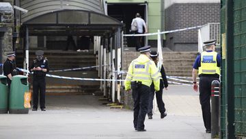 Police at the scene at Amman Valley school after three people were injured, in Ammanford, Wales, Wednesday April 24, 2024. 