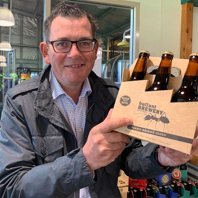 Daniel Andrews with beers in hand. February 2020