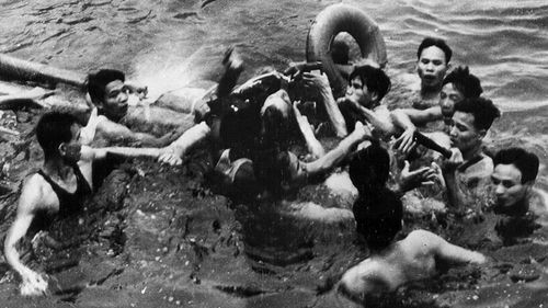 John McCain is rescued from his crashed plane by North Vietnamese people before being taken captive in 1967. (AAP)