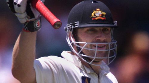 Cricket great Michael Slater has been charged with assault.