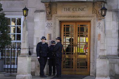 Police officers stand outside an entrance to The London Clinic in London, Friday, Jan. 26, 2024. Buckingham Palace says King Charles III been admitted to a private London hospital to undergo a "corrective procedure" for an enlarged prostate. The 75-year old king will be treated at the London Clinic, where the Princess of Wales is recovering after undergoing abdominal surgery. (AP Photo/Kirsty Wigglesworth)