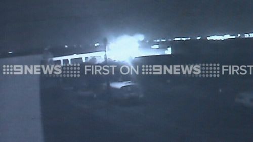 The car burst into flames after plunging from the bridge. (9NEWS)