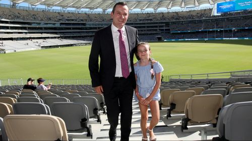 WA premier Mark McGowan at the opening of the new Optus Stadium in Perth, with his daughter Amelie. (AAP)