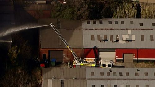 Firefighters struggle to put out a blaze near Penrith, in Sydney's West. (9NEWS)