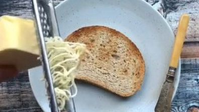 Use a bread knife to scrape cold butter and spread it easily