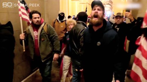A frenzied mob storms the US Capitol building. 