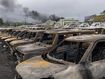 Burnt cars are lined up after unrest that erupted following protests over voting reforms in Noumea, New Caledonia