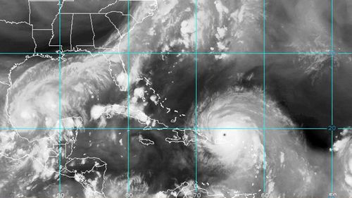 A satellite photo shows the sheer size of Irma, with Katia forming to the far left. (NOAA)