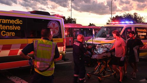 A person is transported to an ambulance in North Bondi following a shooting incident.