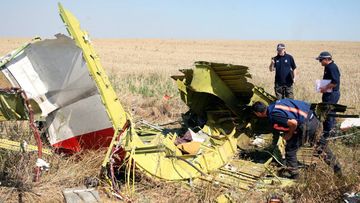 Investigators have had to abandon the MH17 crash site due to shelling. (AAP)