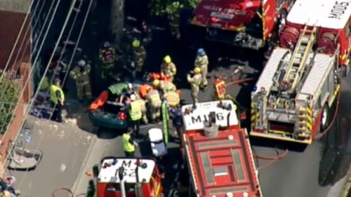 Man seriously hurt after crashing car into pole on Melbourne's Hoddle Street