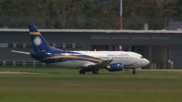 A Nauru Airlines flight believed to be carrying some of the latest group of asylum seekers to make it to Australia, was seen at Amberley Air base west of Brisbane.