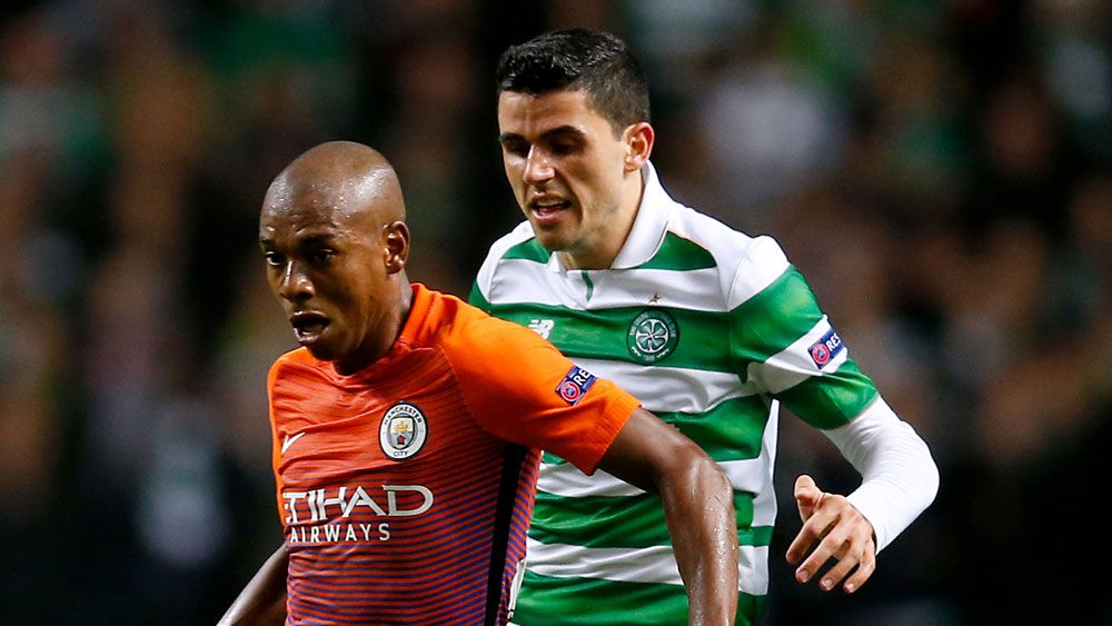Tom Rogic battles against Manchester City in the Champions League. (AAP)
