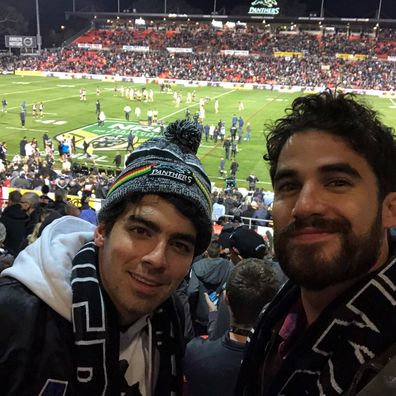 Darren Criss (right) with Joe Jonas (left) at an NRL game in Australia in 2018.