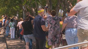 There were long lines at a walk-in vaccination clinic in the Adelaide suburb of Wayville with many waiting   for a COVID-19 booster shot.