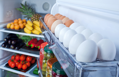 Healthy fridge stocked with vegetables and eggs