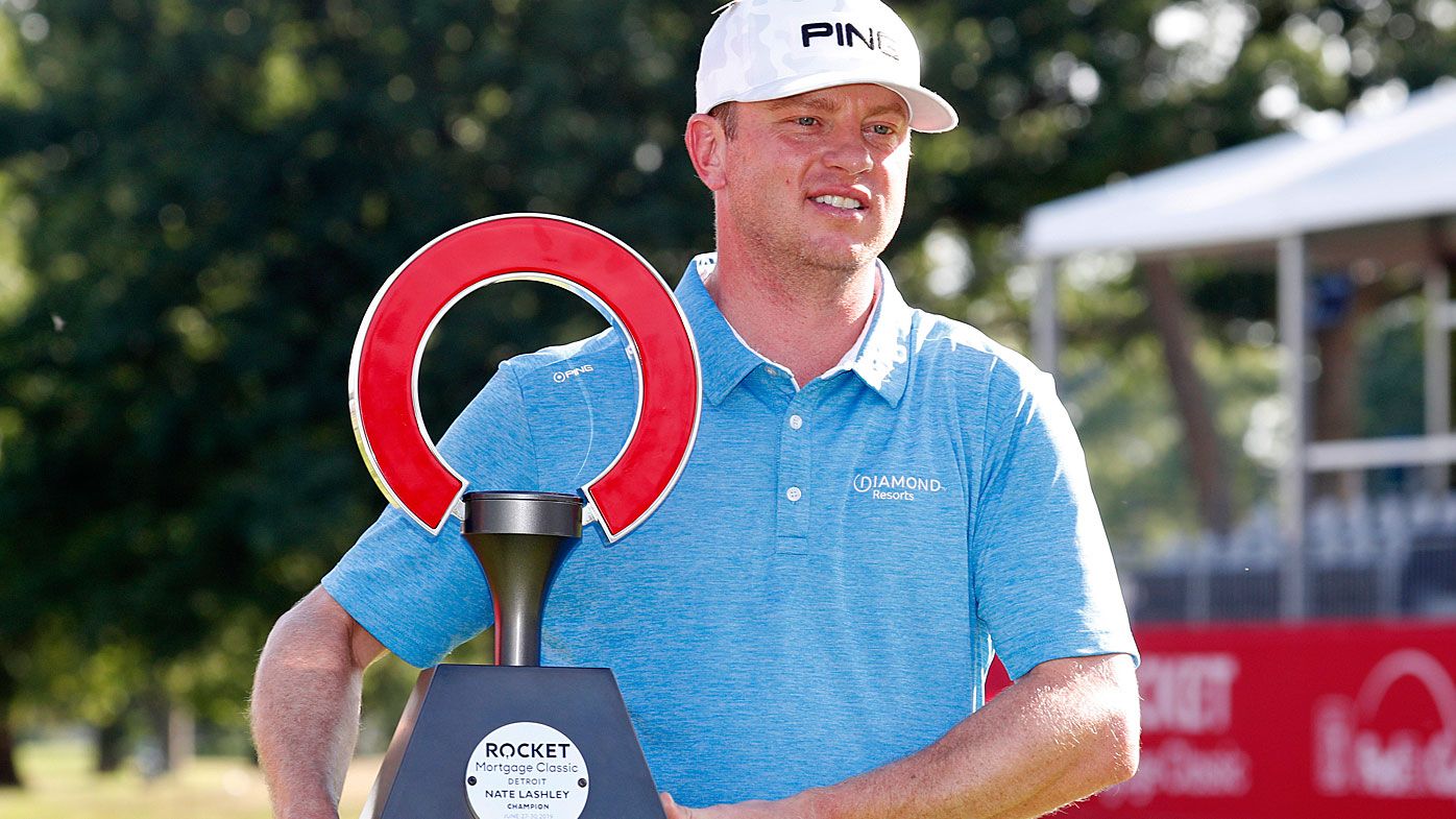Nate Lashley poses with the trophy after winning the Rocket Mortgage Classic 