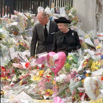 The Queen and the Duke of Edinburgh view the floral tributes to Diana, Princess of Wales, at Buckingham Palace.   (Photo by John Stillwell - PA Images/PA Images via Getty Images)