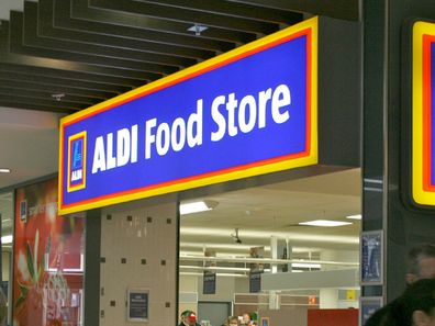 Aldi worker customers eating grapes
