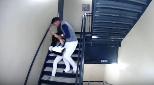 Vasquez then drags the woman down the stairs by her hair. (Supplied)