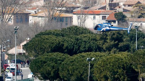 A helicopter arrives at the scene. (AP/AAP)