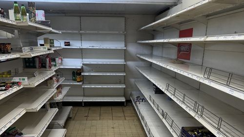 Empty shelves at a supermarket in New Caledonia.