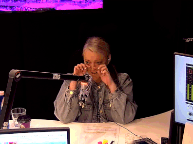 Jackie O tears up while reading the letter on air.