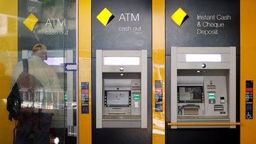 A man uses a Commonwealth Bank of Australia ATM in Sydney, Australia, April 19, 2018.