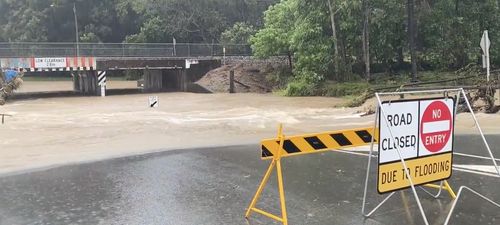 Low lying roads on the Sunshine Coast turning into creeks after heavy downpours this morning. 