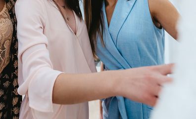 Bride and her friends at a dress fitting