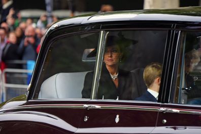 Catherine, Princess of Wales, Camilla, Queen Consort and Prince George of Wales are seen on The Mall ahead of The State Funeral for Queen Elizabeth II on September 19, 2022 in London, England.