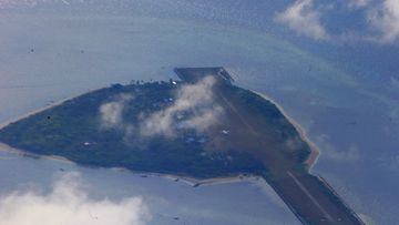 This photo taken from a C-130 transport plane shows Thitu Island off the South China Sea, April 21, 2017. 