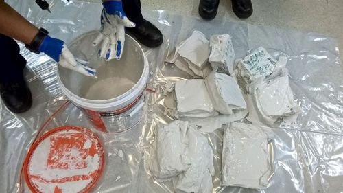 A supplied image obtained on October 6, 2017 of 350 kilograms of methamphetamine's hidden inside buckets of plaster. Authorities have seized the biggest haul of methamphetamine precursor chemicals in Australian history with a potential street value of $3.6 billion. (AAP)