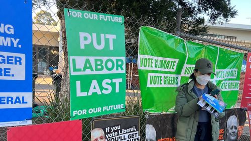 Labor is seeking an injunction over "Put Labor Last" signs appearing in Higgins, designed to look like they were placed by the Greens but allegedly from the Liberal Party.