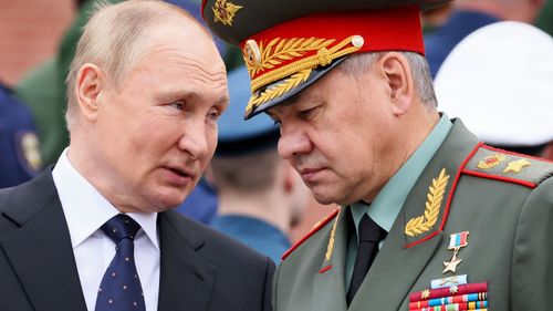 Russian President Vladimir Putin talks with Russian Defense Minister Sergei Shoigu. 