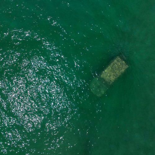 A mystery from the deep has befuddled locals in Bunbury, WA, after an unidentified sunken car was found submerged in the water.